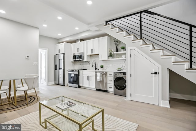 611 Kennedy St NW Unit 402, Washington, DC 20011 - unfurnished living room with washer / dryer, recessed lighting, stairway, light wood-style floors, and baseboards