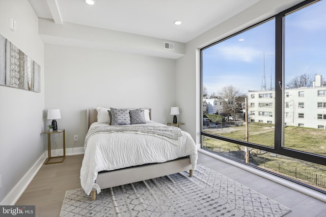 611 Kennedy St NW Unit 402, Washington, DC 20011 - bedroom featuring wood finished floors, recessed lighting, and baseboards