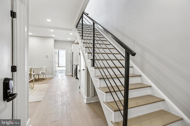 611 Kennedy St NW Unit 402, Washington, DC 20011 - stairs featuring recessed lighting, wood-type flooring, and baseboards