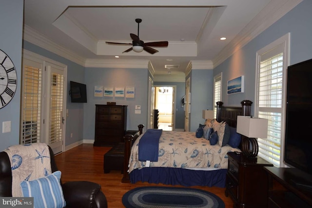 35517 Bonaire Dr, Rehoboth Beach, DE 19971 - bedroom featuring wood finished floors, a tray ceiling, ornamental molding, and a ceiling fan