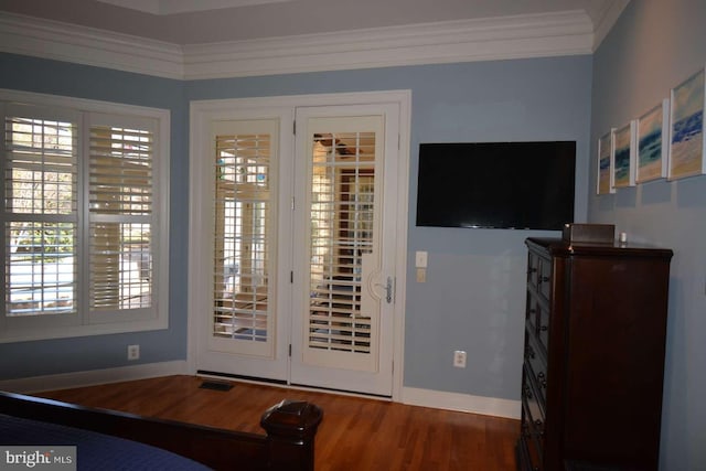 35517 Bonaire Dr, Rehoboth Beach, DE 19971 - doorway with baseboards, ornamental molding, and wood finished floors