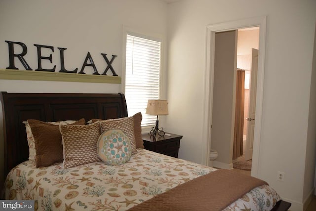 35517 Bonaire Dr, Rehoboth Beach, DE 19971 - bedroom with connected bathroom and baseboards