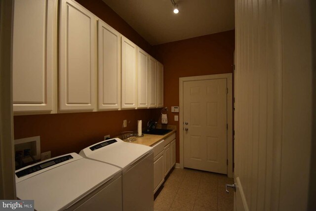 35517 Bonaire Dr, Rehoboth Beach, DE 19971 - laundry area with washing machine and dryer and cabinet space