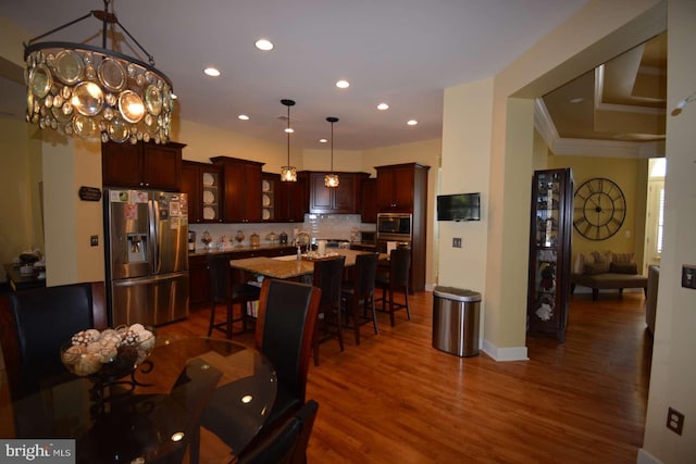 35517 Bonaire Dr, Rehoboth Beach, DE 19971 - dining space featuring dark wood finished floors, recessed lighting, a chandelier, crown molding, and baseboards