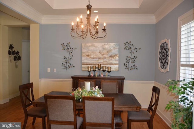 35517 Bonaire Dr, Rehoboth Beach, DE 19971 - dining space featuring a chandelier, wood finished floors, crown molding, and a tray ceiling