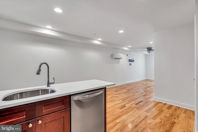 821 N 15th St Unit 2, Philadelphia, PA 19130 - kitchen with stainless steel dishwasher, a sink, recessed lighting, a wall mounted AC, and light wood finished floors