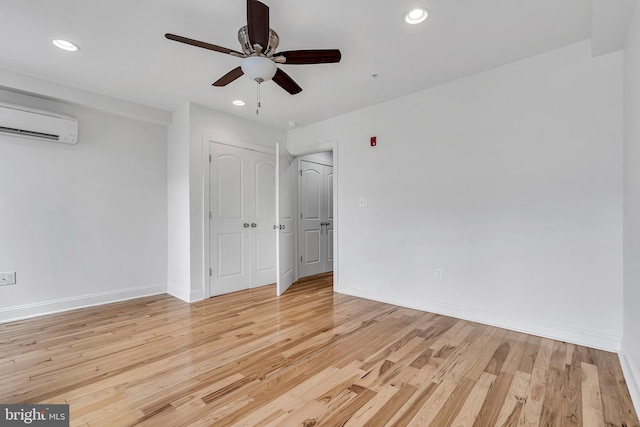 821 N 15th St Unit 2, Philadelphia, PA 19130 - unfurnished room featuring a wall unit AC, a ceiling fan, recessed lighting, light wood-style floors, and baseboards
