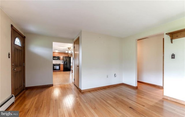 1195 Hemlock St, Palmerton, PA 18071 - entryway featuring a baseboard heating unit, light wood finished floors, baseboards, and ceiling fan