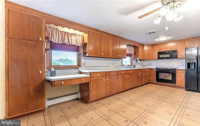 1195 Hemlock St, Palmerton, PA 18071 - kitchen featuring black appliances, a baseboard radiator, light countertops, and light floors
