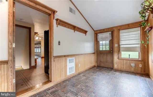 1195 Hemlock St, Palmerton, PA 18071 - entryway featuring wood walls, vaulted ceiling, brick patterned floors, a wainscoted wall, and a ceiling fan