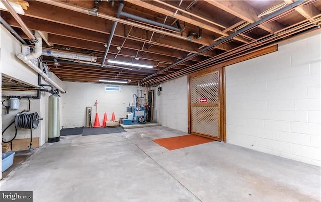 1195 Hemlock St, Palmerton, PA 18071 - unfinished below grade area featuring a heating unit and concrete block wall