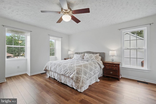 4549 Diehl Ct, Woodbridge, VA 22193 - bedroom featuring a textured ceiling, wood finished floors, baseboards, and ceiling fan