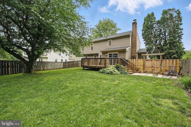 4549 Diehl Ct, Woodbridge, VA 22193 - back of house with a deck, a chimney, and a patio area