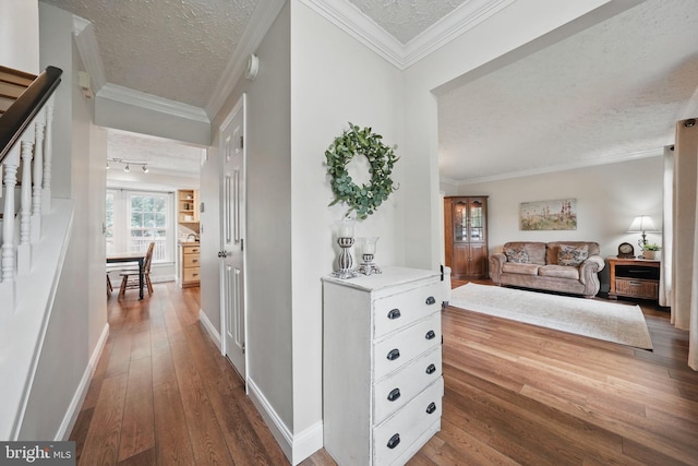 4549 Diehl Ct, Woodbridge, VA 22193 - corridor featuring a textured ceiling, wood-type flooring, baseboards, and ornamental molding