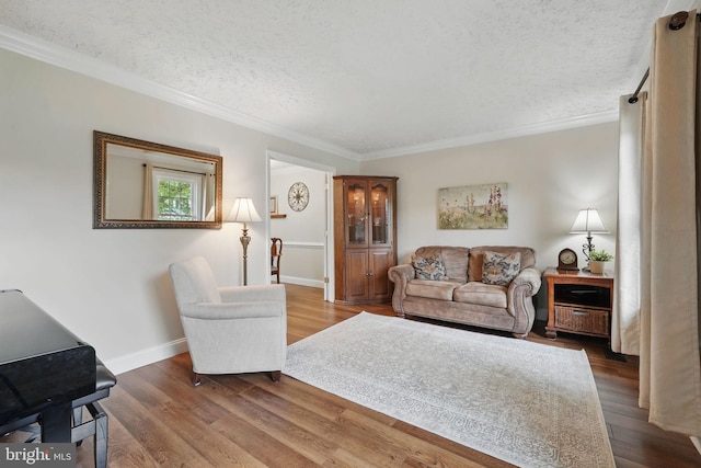 4549 Diehl Ct, Woodbridge, VA 22193 - living area featuring crown molding, dark wood-type flooring, baseboards, and a textured ceiling