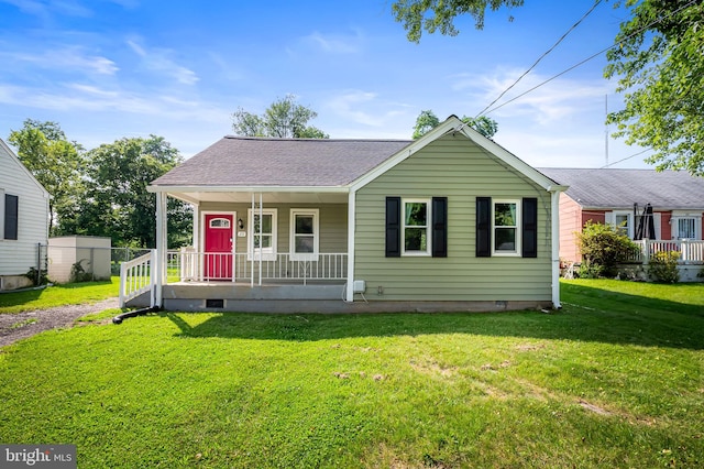 20 Village Rd, Baltimore, MD 21208 - view of front of home with covered porch, a front yard, crawl space, and a shingled roof