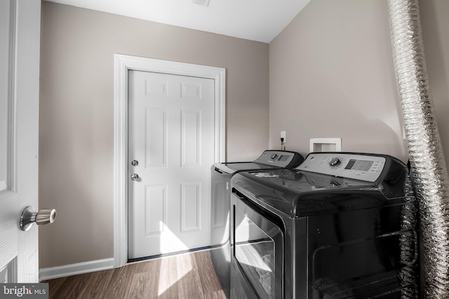 20 Village Rd, Baltimore, MD 21208 - laundry area with washer and dryer and wood finished floors
