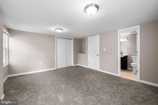 20 Village Rd, Baltimore, MD 21208 - unfurnished bedroom with carpet flooring, a closet, and connected bathroom