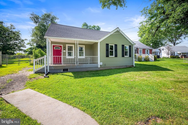 20 Village Rd, Baltimore, MD 21208 - view of front facade with a porch, crawl space, and roof with shingles