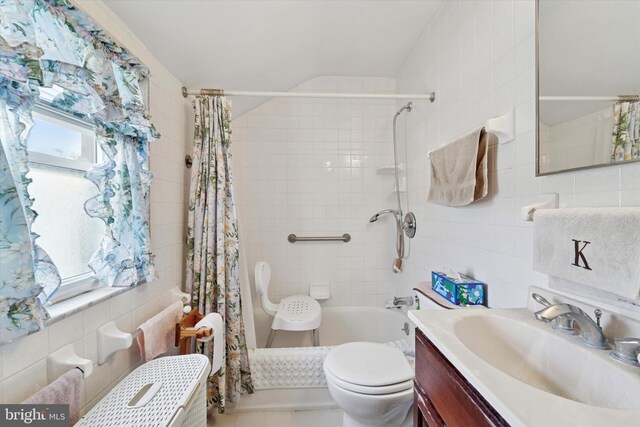 224 Montgomery Ave, Oreland, PA 19075 - bathroom featuring tile walls, shower / bath combo with shower curtain, toilet, vanity, and tile patterned floors