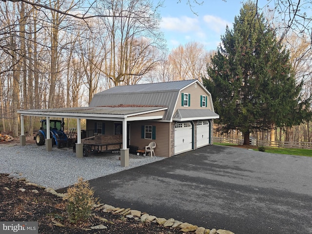 114 Moore Ln, Gap, PA 17527 - garage featuring a porch and asphalt driveway
