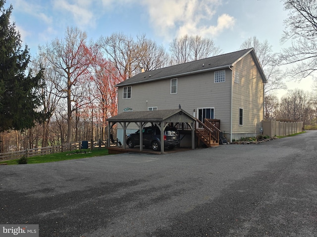 114 Moore Ln, Gap, PA 17527 - rear view of property featuring stairway, a chimney, and a carport