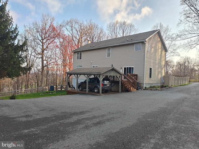 114 Moore Ln, Gap, PA 17527 - back of house featuring stairs, a chimney, and a carport