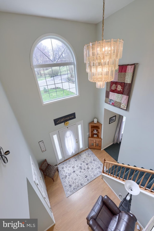 114 Moore Ln, Gap, PA 17527 - foyer entrance with wood finished floors, a chandelier, and a towering ceiling