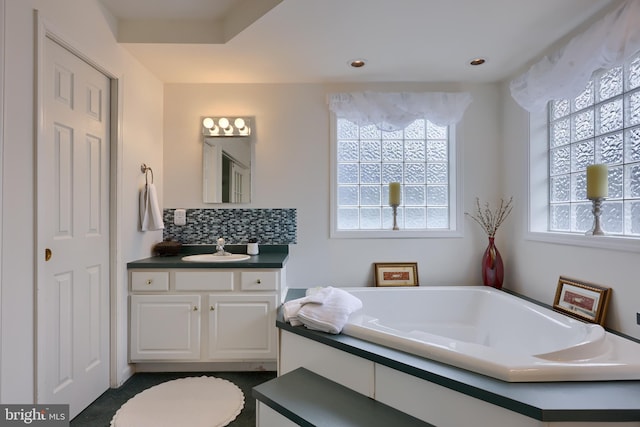 114 Moore Ln, Gap, PA 17527 - bathroom featuring plenty of natural light, vanity, a garden tub, and tasteful backsplash