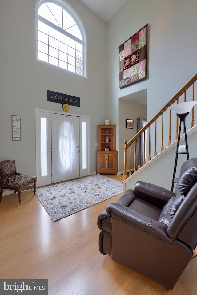 114 Moore Ln, Gap, PA 17527 - entrance foyer featuring a towering ceiling, stairway, and wood finished floors