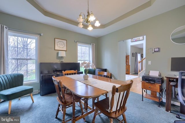 114 Moore Ln, Gap, PA 17527 - dining area featuring a chandelier, light carpet, a raised ceiling, and stairway
