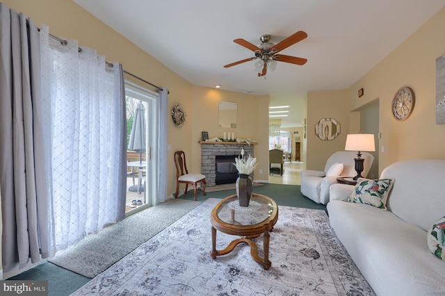 114 Moore Ln, Gap, PA 17527 - carpeted living room featuring a fireplace, plenty of natural light, and a ceiling fan