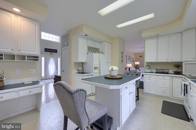 114 Moore Ln, Gap, PA 17527 - kitchen featuring a center island, white cabinetry, and white appliances