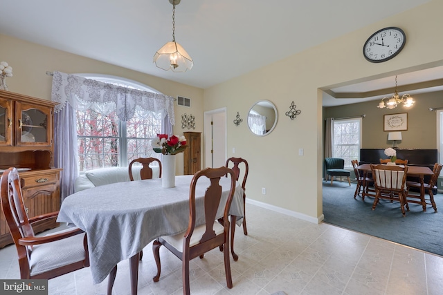 114 Moore Ln, Gap, PA 17527 - dining area featuring light colored carpet, baseboards, and a chandelier