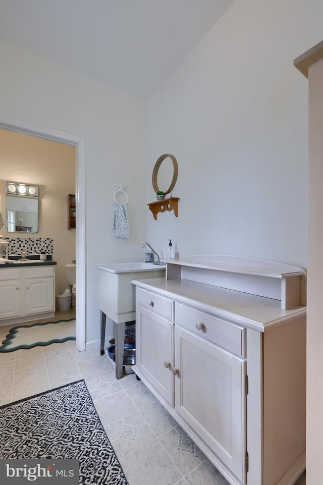 114 Moore Ln, Gap, PA 17527 - full bathroom with toilet, vanity, decorative backsplash, and tile patterned floors