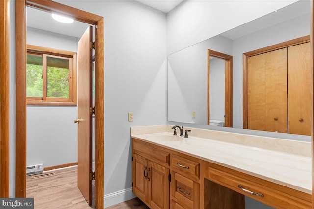 12549 Jesse Smith Rd, Mount Airy, MD 21771 - bathroom featuring vanity, wood finished floors, toilet, and baseboards