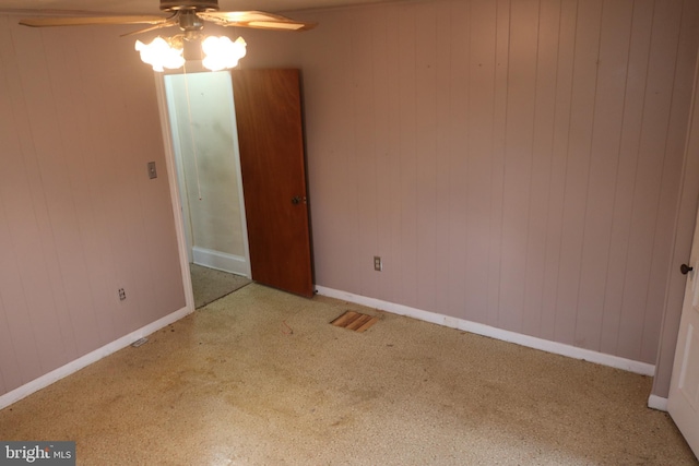 85 S St, Hanover, PA 17331 - spare room featuring a ceiling fan, carpet floors, and wood walls