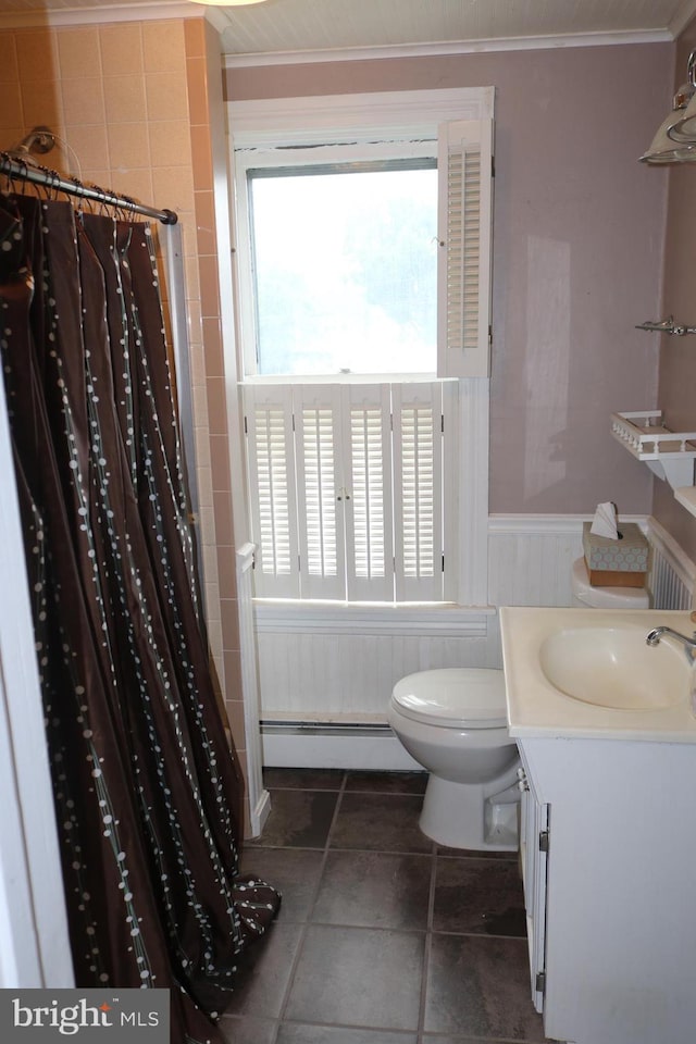 85 S St, Hanover, PA 17331 - bathroom featuring a baseboard heating unit, wainscoting, tile patterned flooring, crown molding, and vanity