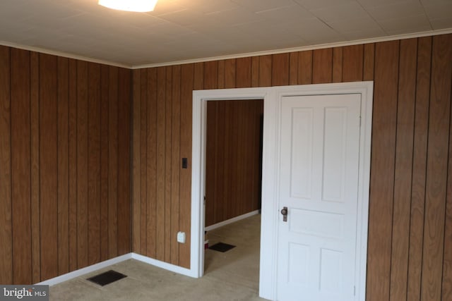 85 S St, Hanover, PA 17331 - spare room featuring wood walls and light colored carpet