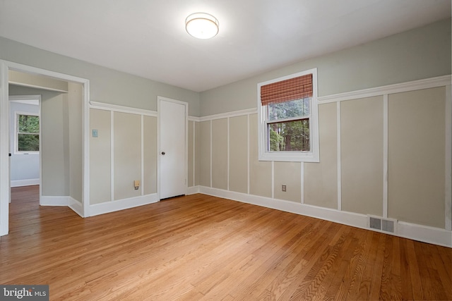 5604 Edgemont Dr, Alexandria, VA 22310 - unfurnished bedroom with light wood-type flooring and two closets