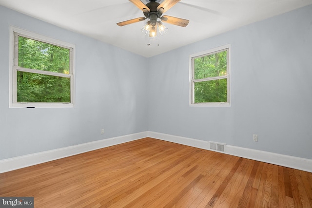 5604 Edgemont Dr, Alexandria, VA 22310 - unfurnished room featuring plenty of natural light, light wood-style floors, baseboards, and a ceiling fan