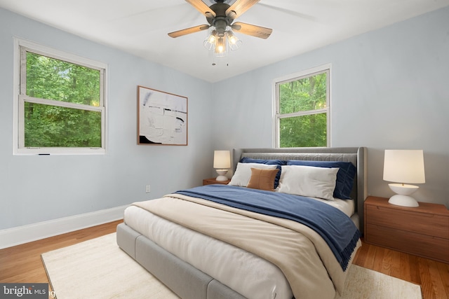 5604 Edgemont Dr, Alexandria, VA 22310 - bedroom featuring multiple windows, wood finished floors, baseboards, and a ceiling fan