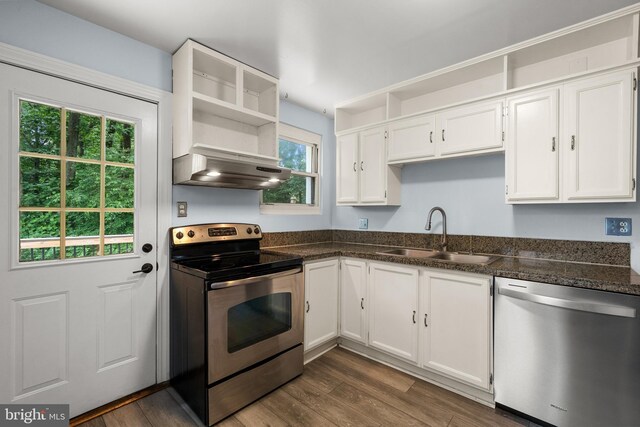 5604 Edgemont Dr, Alexandria, VA 22310 - kitchen featuring stainless steel appliances, exhaust hood, a sink, white cabinets, and dark wood-style flooring
