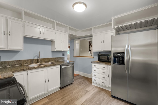 5604 Edgemont Dr, Alexandria, VA 22310 - kitchen with black appliances, a sink, white cabinets, light wood finished floors, and dark countertops