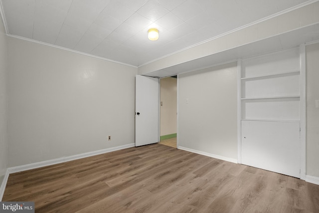 5604 Edgemont Dr, Alexandria, VA 22310 - unfurnished bedroom with ornamental molding, wood finished floors, and baseboards