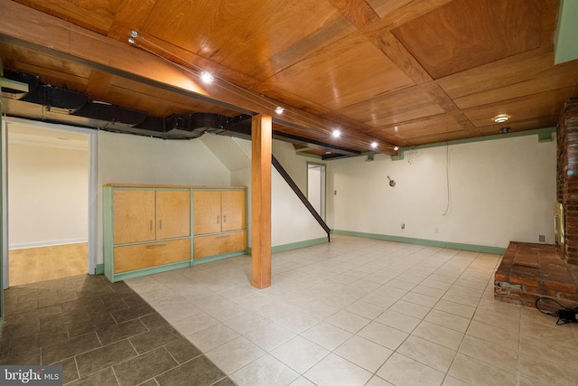 5604 Edgemont Dr, Alexandria, VA 22310 - finished basement with wooden ceiling, tile patterned flooring, and baseboards