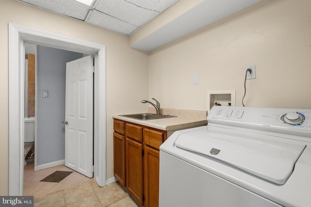 5604 Edgemont Dr, Alexandria, VA 22310 - laundry area with washer / dryer, cabinet space, light tile patterned floors, and baseboards