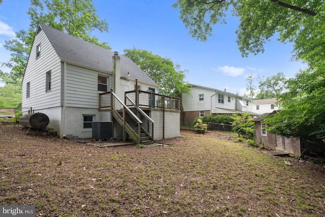 5604 Edgemont Dr, Alexandria, VA 22310 - rear view of house with stairway, a shingled roof, central AC, heating fuel, and a deck