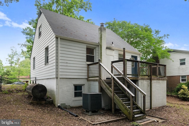 5604 Edgemont Dr, Alexandria, VA 22310 - back of property with cooling unit, roof with shingles, oil tank, and a deck