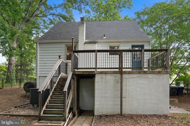 5604 Edgemont Dr, Alexandria, VA 22310 - back of property with stairs, a wooden deck, a shingled roof, and central AC